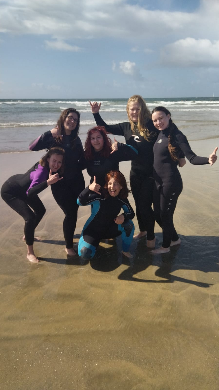 Surf instructor teaching at Aguda Beach with Okira 2 Surf